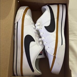 Nike White Sneakers with Black and Gold Accents